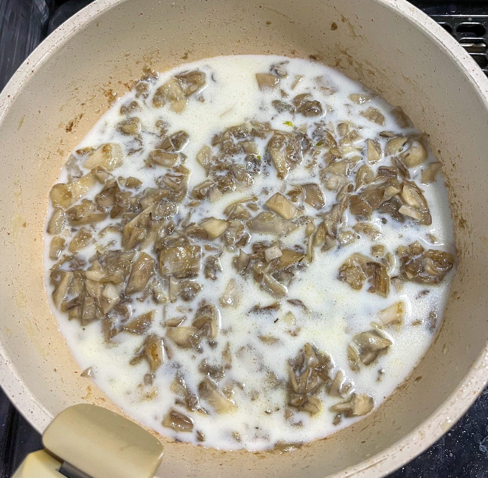 cream of mushroom soup maitake in a pan